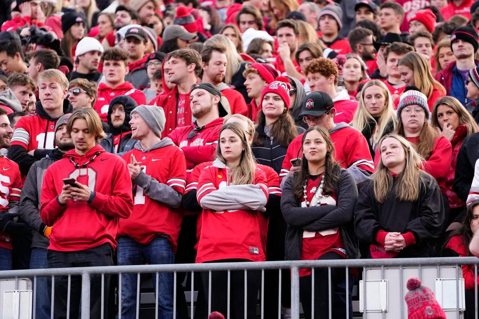 Nov 26, 2022; Columbus, Ohio, USA;  Ohio State Buckeyes fans react to an interception throw by quarterback C.J. Stroud during the second half of the NCAA football game against the Michigan Wolverines at Ohio Stadium. Ohio State lost 45-23. Mandatory Credit: Adam Cairns-The Columbus Dispatch