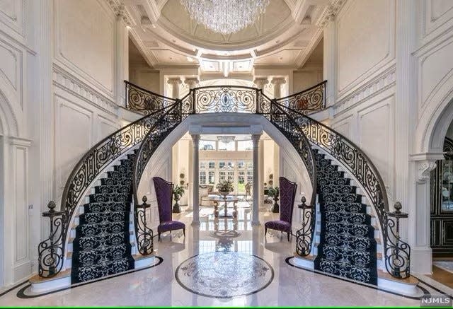 This $22.5 million home for sale in Alpine, N.J., is 25,700 square feet with seven bedrooms and 12 bathrooms, stunning staircases, an elevator and a couple of indoor pools.