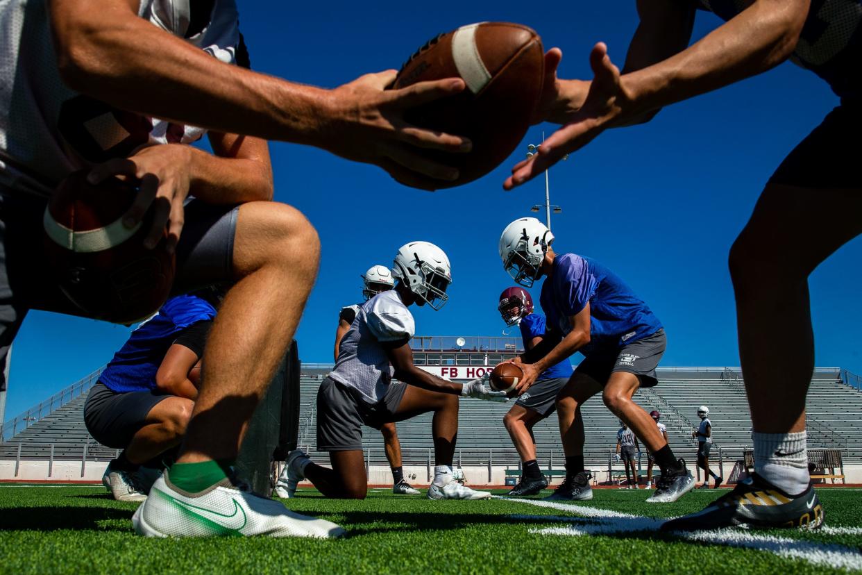 Quarterbacks do passing drills at a Flour Bluff football practice on Wednesday, August 10, 2022 at Hornet Stadium in Corpus Christi, Texas.