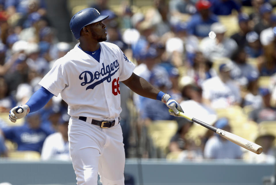 Los Angeles Dodgers' Yasiel Puig watches his second two-run home run of the game, against the San Diego Padres during the fourth inning of a baseball game in Los Angeles, Thursday, April 6, 2017. (AP Photo/Alex Gallardo)