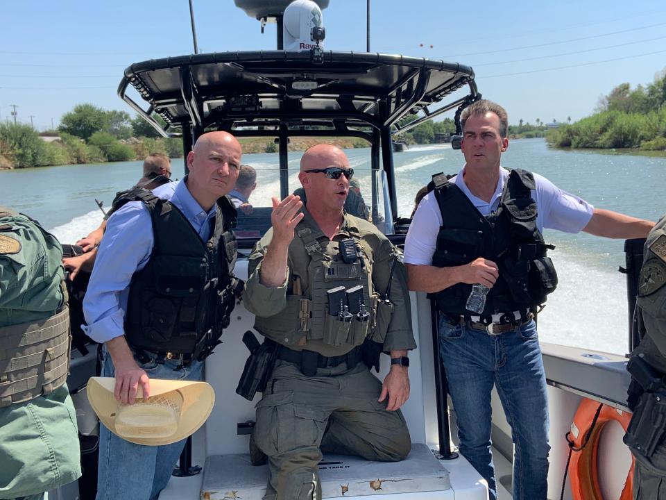 Gov. Kevin Stitt receives a tour of the U.S.-Mexico border via boat in 2021.