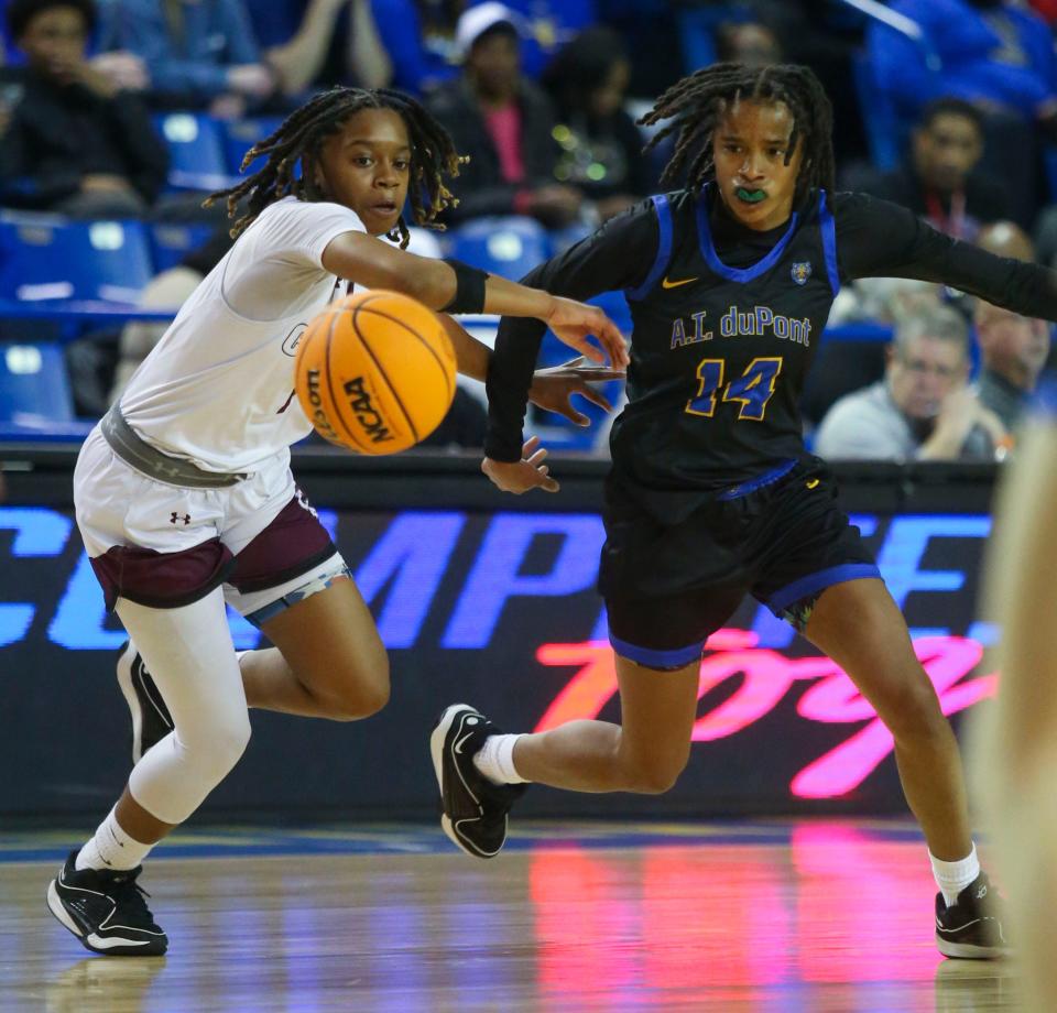 Caravel's Chasity Wilson (left) pursues the ball with A.I. du Pont's Sydney Hilliard in the first half a DIAA state tournament semifinal at the Bob Carpenter Center, Wednesday, March 6, 2024.