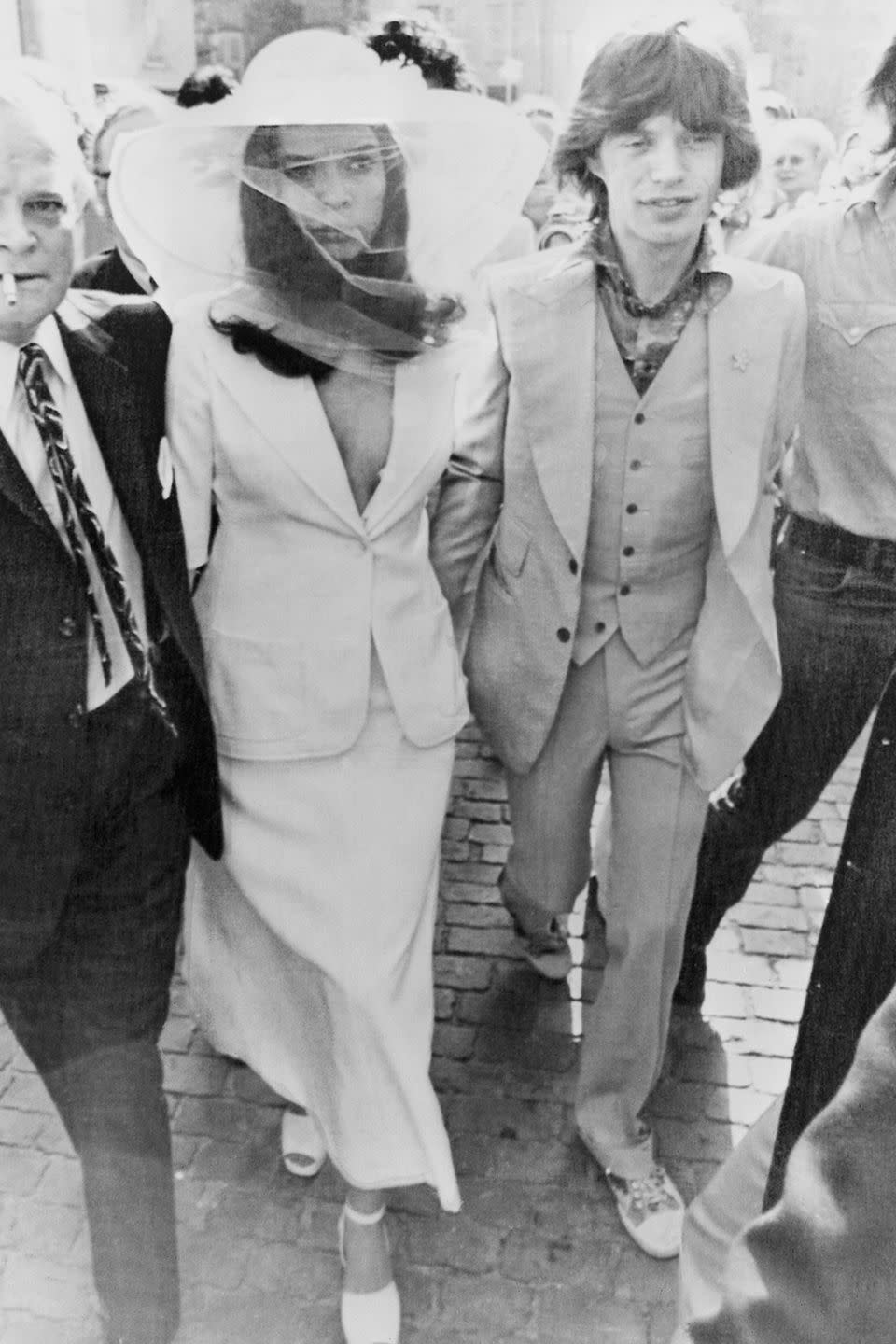 <p>The actress was truly an original when she wore a skirt suit with a plunging neckline and a veiled, wide-brim hat to marry rock star Mick Jagger. Matching ankle-strap sandals rounded out the ensemble at the small Roman Catholic ceremony in Saint-Tropez.</p>