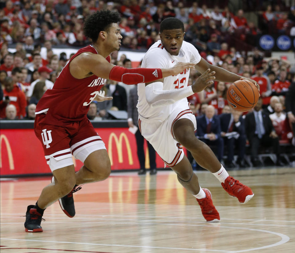 Ohio State's E.J. Liddell, right, drives to the basket against Indiana's Justin Smith during the second half of an NCAA college basketball game Saturday, Feb. 1, 2020, in Columbus, Ohio. Ohio State beat Indiana 68-59. (AP Photo/Jay LaPrete)