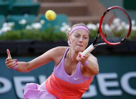 Petra Kvitova of the Czech Republic returns the ball to Timea Bacsinszky of Switzerland during their women's singles match during the French Open tennis tournament at the Roland Garros stadium in Paris, France, June 1, 2015. REUTERS/Jean-Paul Pelissier