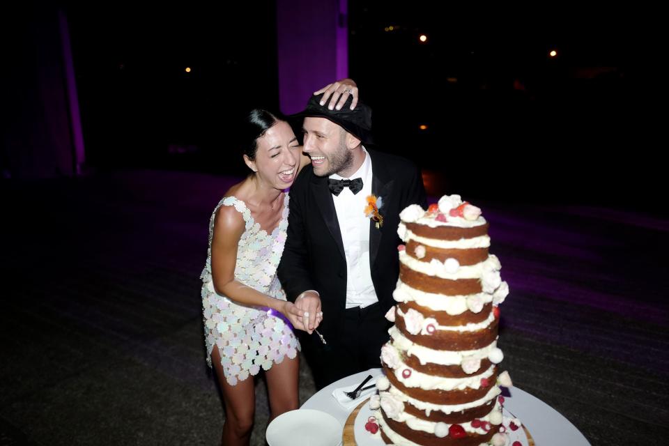 We opted to cut our cake around 1:00 a.m., which led to Michael deciding to cut the cake starting from the top tier. We are so lucky it didn’t topple over.