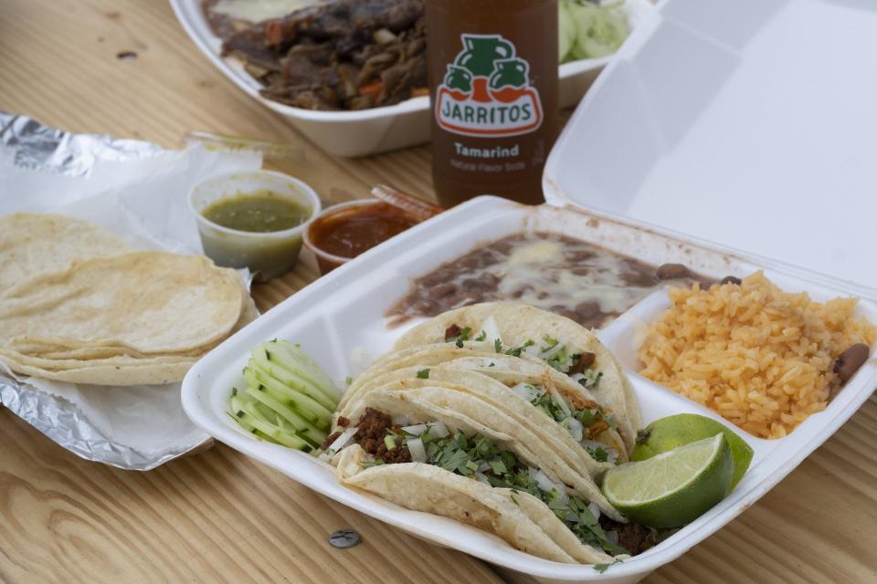 Three taco combo (chorizo, tinga, pastor - "mexican" style with cilantro & onions) and Bistec Ranchero from La Poblamita, a Mexican food truck on Indianola Ave that was stolen then redcovered at the end of 2021. (Photo by Tim Johnson)