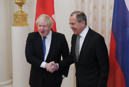 Russian Foreign Minister Sergei Lavrov (R) shakes hands with British Foreign Secretary Boris Johnson during a meeting in Moscow, Russia December 22, 2017. REUTERS/Maxim Shemetov