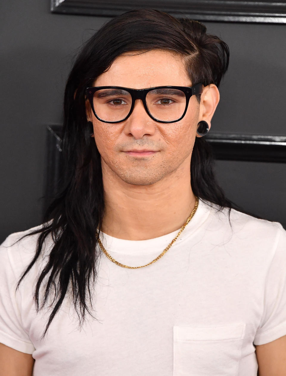 Close-up of Skrillex showing the thin chain necklace he's also wearing