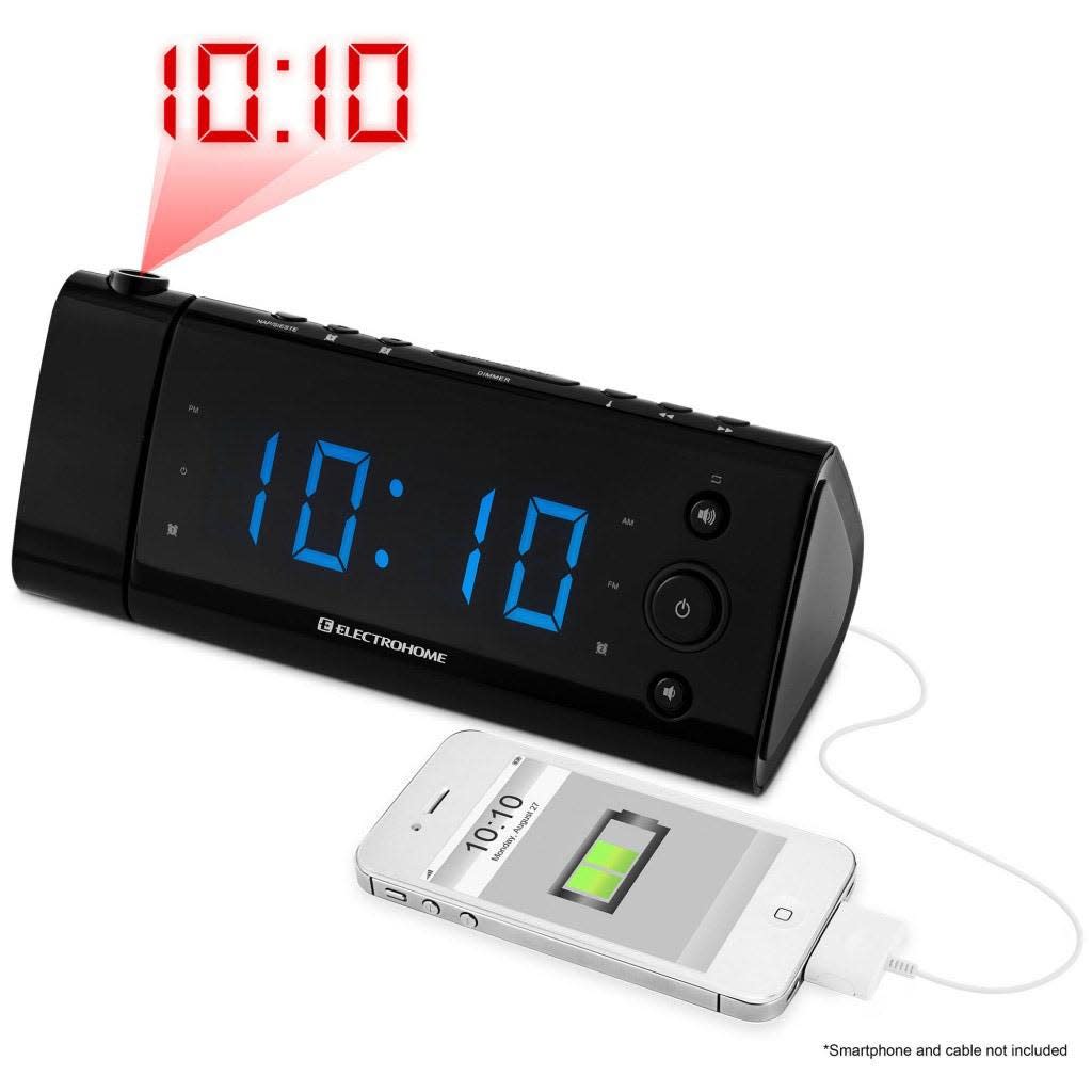 The USB Charging Alarm Clock Radio by Electrohome shows the time on its LED display while also projecting the time on a wall.