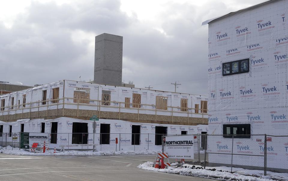 The Rise Apartments development is under construction at North Oneida and West Harris Streets on Tuesday, December 5, 2023, in Appleton, Wis. The townhomes and midrise apartment building will open in phases in 2024.