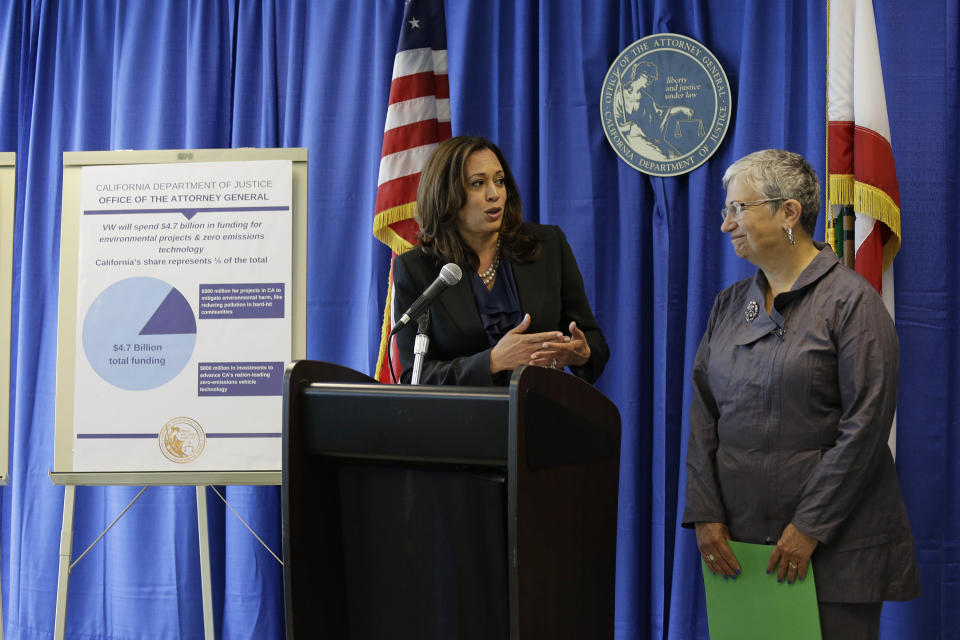 FILE - In this June 28, 2016, file photo, California Attorney General Kamala Harris, left, pays tribute to Mary Nichols, right, Chair of the California Air Resources Board, while announcing a settlement with Volkswagen during a news conference in San Francisco. Nichols' term leading the board ends in December 2020. She's held the role since 2007 after an earlier stint as chair in the early 1980s. (AP Photo/Eric Risberg, File)