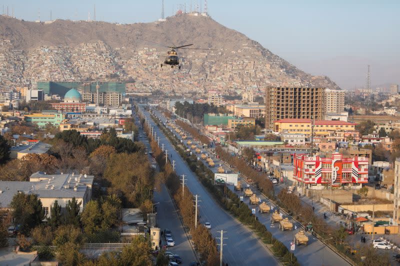 A military helicopter is pictured during the Taliban military parade in Kabul