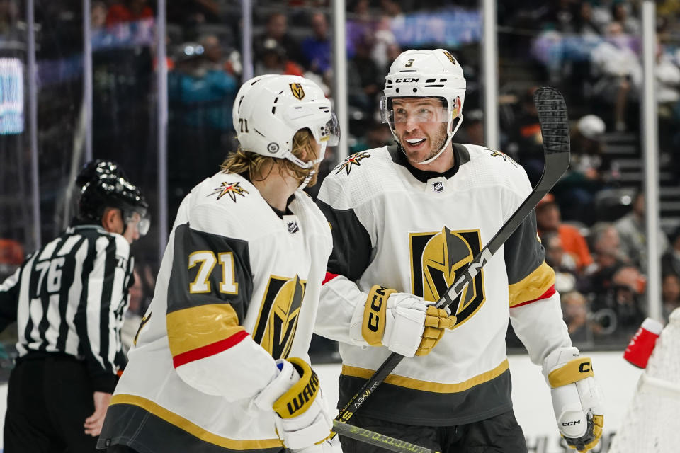 Vegas Golden Knights center William Karlsson (71) and defenseman Brayden McNabb (3) react after a goal scored by center Jack Eichel during the second period of an NHL hockey game against the Anaheim Ducks, Sunday, Nov. 5, 2023, in Anaheim, Calif. (AP Photo/Ryan Sun)