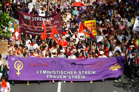 Protesters carry banners and placards at a demonstration during a women's strike (Frauenstreik) in Zurich