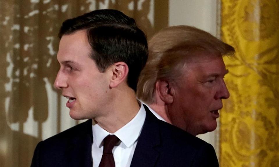 Donald Trump passes his adviser and son-in-law Jared Kushner at the White House in 2017.