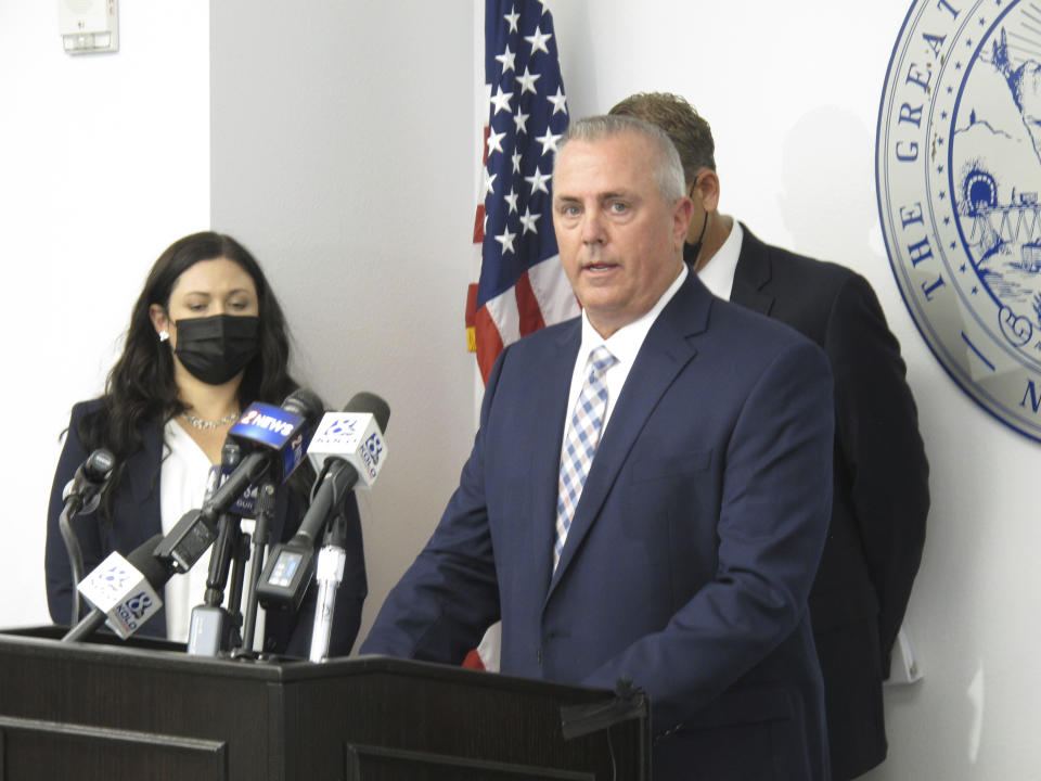 Douglas County District Attorney Mark Jackson addresses the media Thursday, Oct. 21, 2021 in Reno, Nev. Wilber Ernesto Martinez Guzman agreed Thursday to plead guilty to all crimes in the killing of four Nevada residents as part of a deal with prosecutors that will spare him from two death penalty trials and put him in prison for the rest of his life with no possibility of appeals or parole.(AP Photo/Scott Sonner)