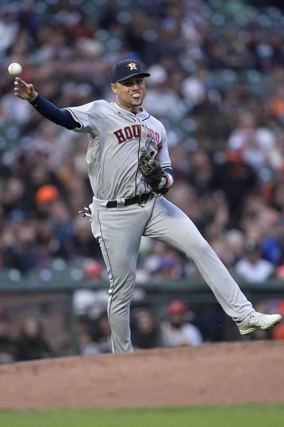 Houston Astros second baseman Aledmys Diaz throws to first base for the out on a ball hit by San Francisco Giants' Donovan Solano during the third inning of a baseball game Friday, July 30, 2021, in San Francisco. (AP Photo/Tony Avelar)