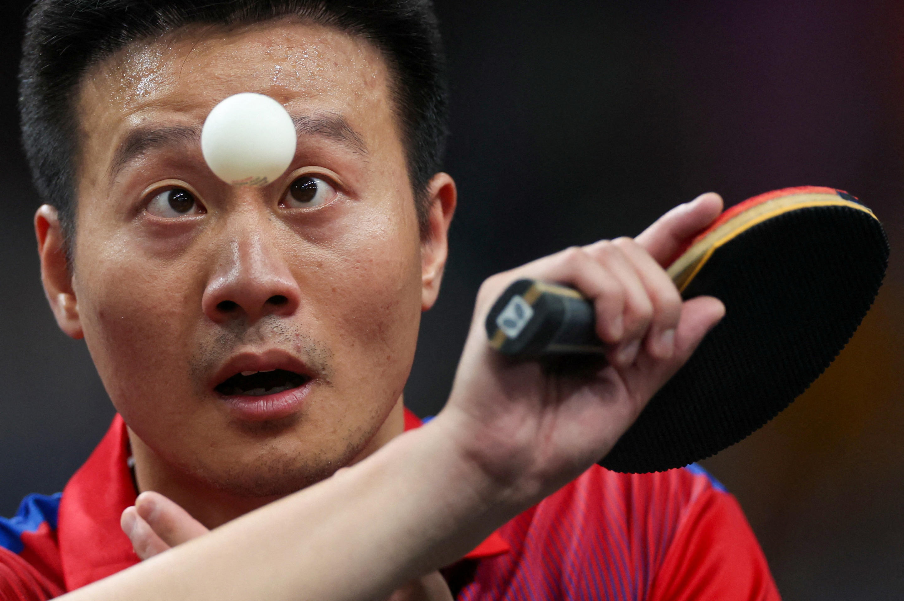 Yang Wang of Slovakia playing table tennis.