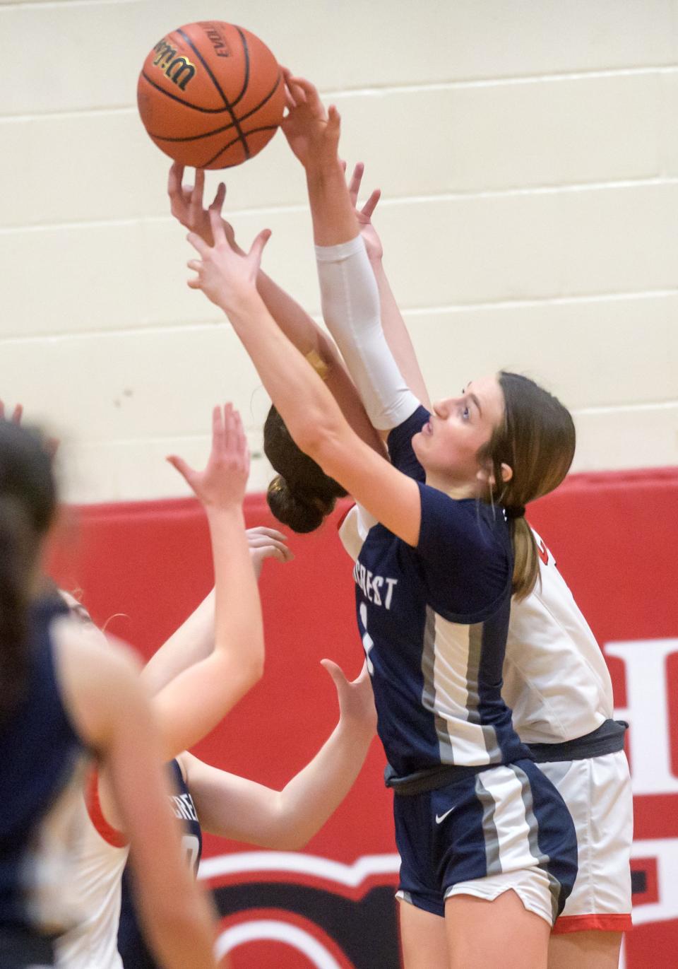 Fieldcrest's Kaitlin White battles Dee-Mack for a rebound in the second half Thursday, Feb. 2, 2023 in Mackinaw. The Knights defeated the Chiefs 62-54.