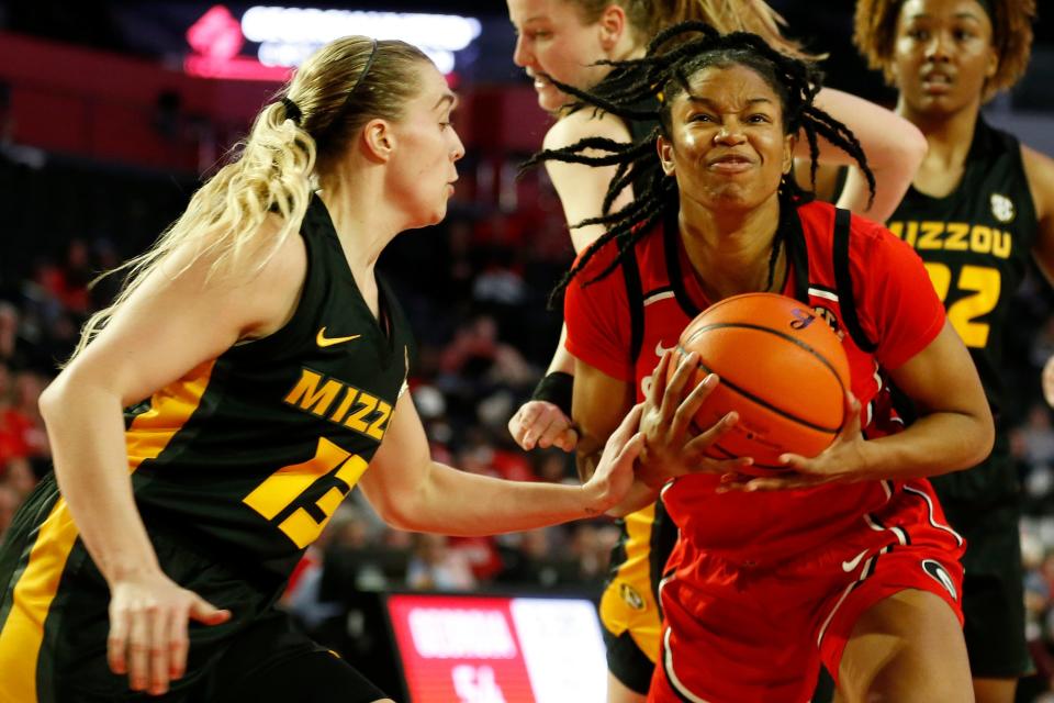 Georgia forward Malury Bates (22) is fouled by Missouri guard Haley Troup (13) during a game Thursday in Athens, Ga.