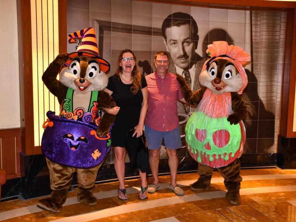 Disney Halloween on the High Seas Cruise - the writer and her husband with chip and dale in halloween costumes