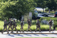 <p>Police respond to a shooting on June 28, 2018 in Annapolis, Md. At least five people were killed Thursday when a gunman opened fire inside the offices of the Capital Gazette, a newspaper published in Annapolis, a historic city an hour east of Washington. A reporter for the daily, Phil Davis, tweeted that a ‘gunman shot through the glass door to the office and opened fire on multiple employees.”There is nothing more terrifying than hearing multiple people get shot while you’re under your desk and then hear the gunman reload,’ Davis said. (Photo: Alex Wroblewski/Getty Images) </p>