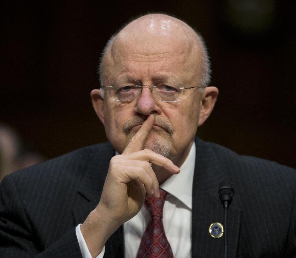 Director of National Intelligence James Clapper pauses while testifying on Capitol Hill in Washington, Wednesday, Jan. 29, 2014, before the Senate Intelligence Committee hearing on current and projected national security threats against the US. (AP Photo/Pablo Martinez Monsivais)