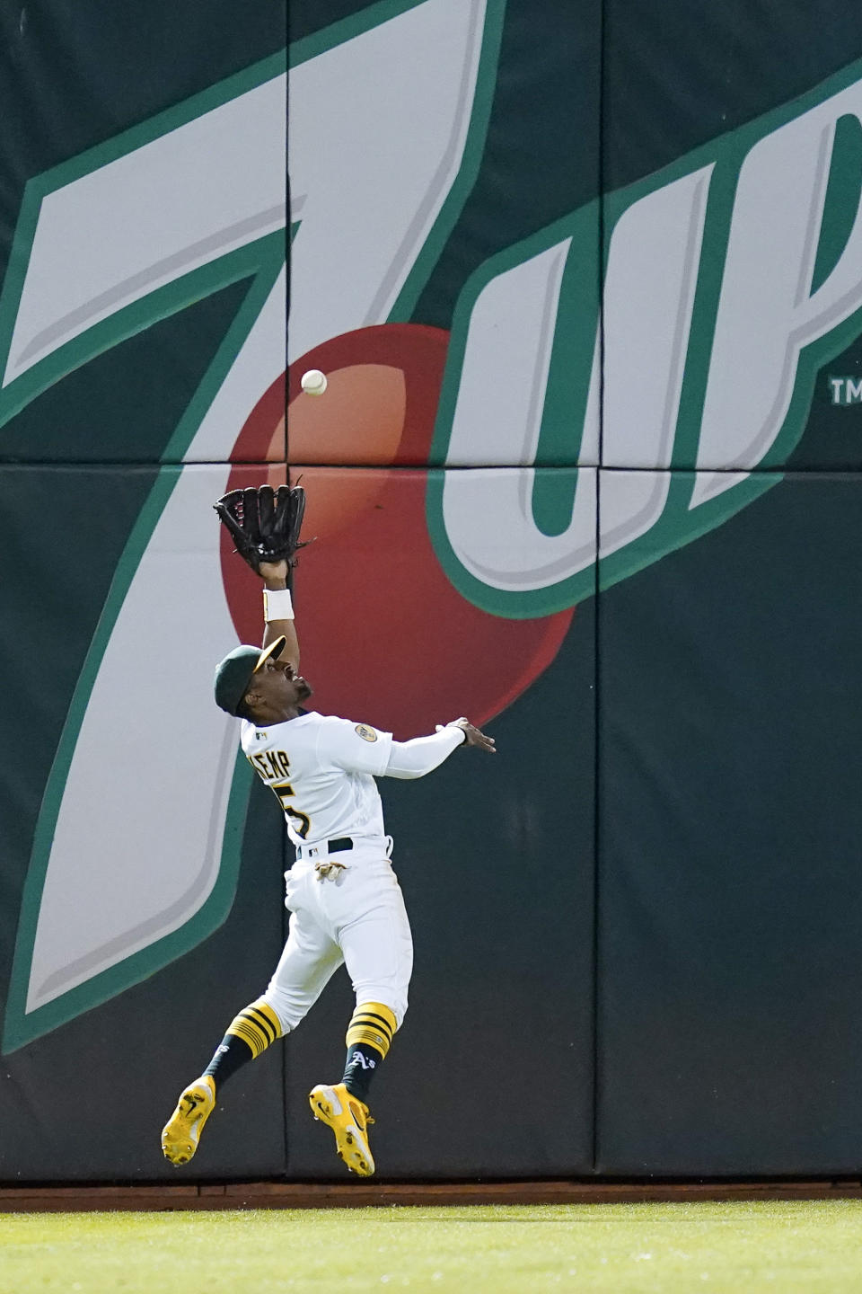 Oakland Athletics' Tony Kemp catches a line out hit by Miami Marlins' Peyton Burdick during the eighth inning of a baseball game in Oakland, Calif., Monday, Aug. 22, 2022. (AP Photo/Godofredo A. Vásquez)