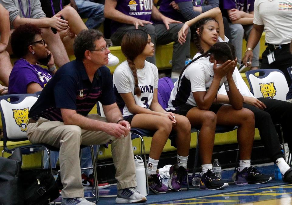 Calvary coach Jackie Hamilton and players on the bench watch in disbelief as the Cavaliers fall behind early during the 3A semifinal game against Lumpkin County on Friday March 3, 2023 at Fort Valley State University.