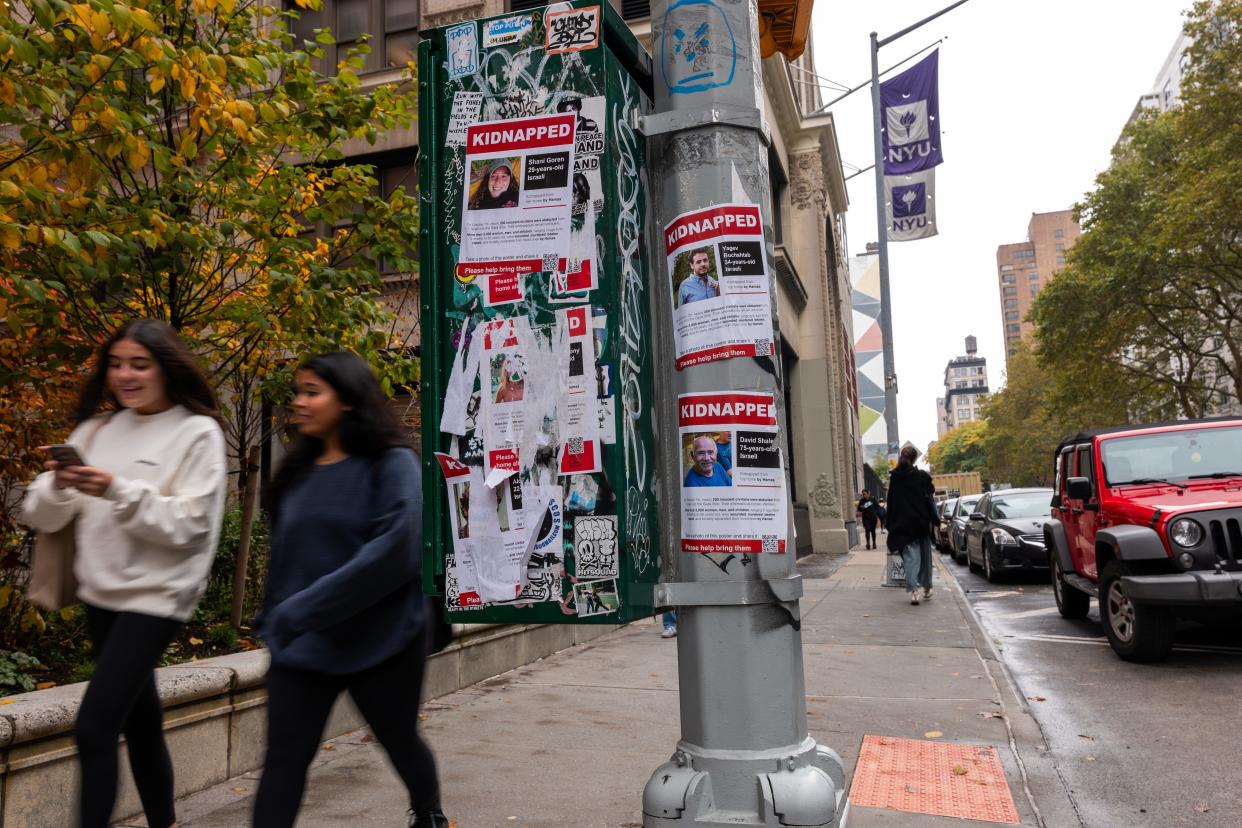 Posters of some of those kidnapped by Hamas in Israeli are displayed on a pole outside of New York University (NYU) as tensions between supporters of Palestine and Israel increase on college campuses across the nation on October 30, 2023 in New York City.