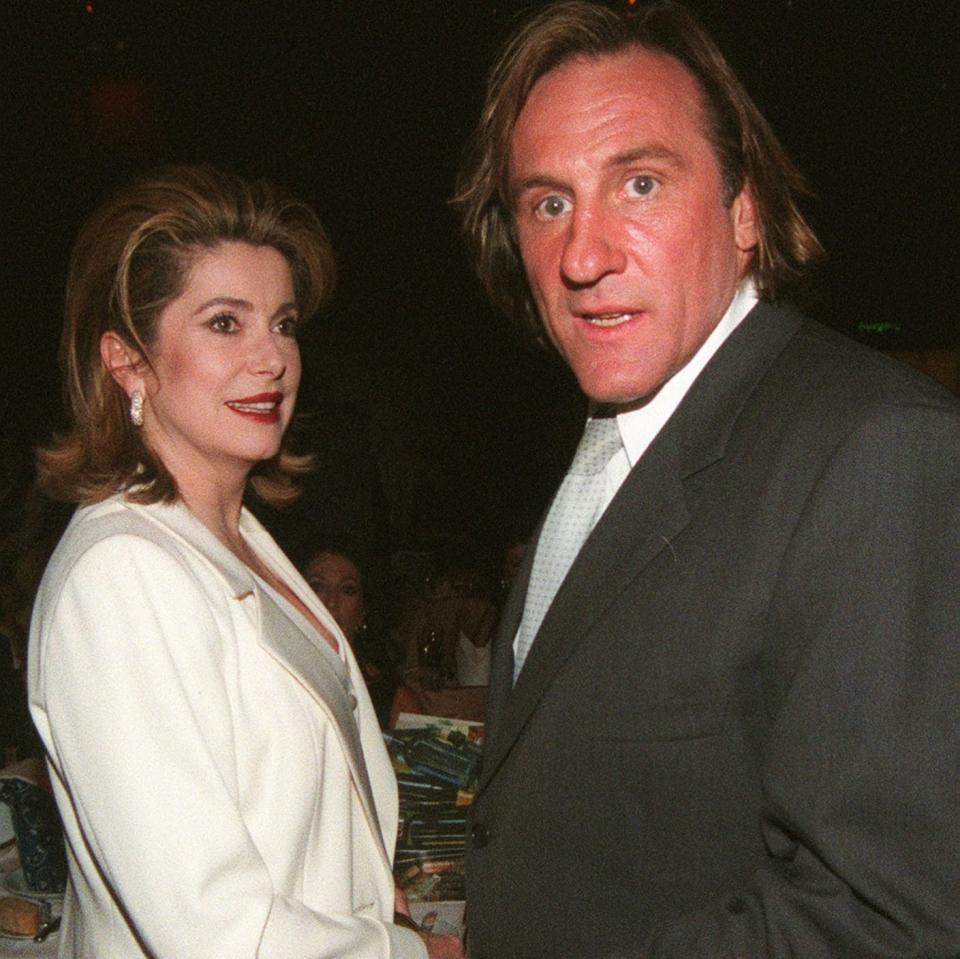 Depardieu with his his friend and sometime defender Catherine Deneuve, in 1998 - AP