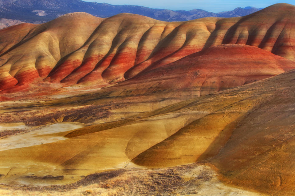 Voluptuous, curvy, indented mountains made up of multicolored sedimentary layers accentuate the John Day Fossil Beds.