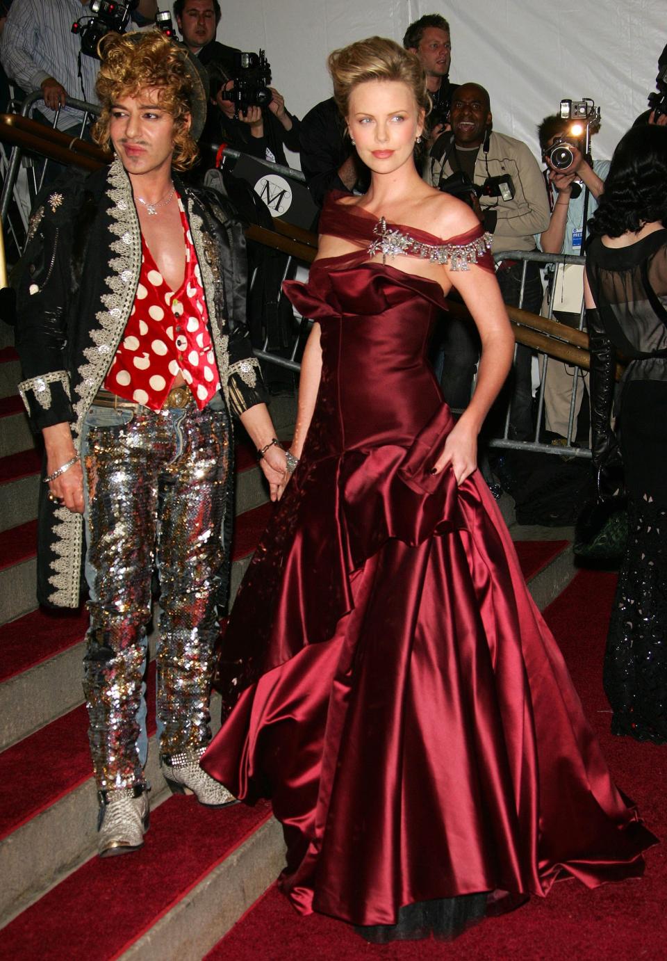 Designer John Galliano and Charlize Theron attend the 2006 Metropolitan Museum of Art Costume Institute Benefit Gala.