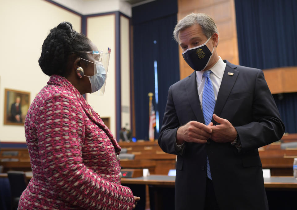 Rep. Sheila Jackson Lee, D-Texas, talks to Federal Bureau of Investigation Director Christopher Wray after he had testified before the House Homeland Security Committee hearing on 'worldwide threats to the homeland', Thursday, Sept. 17, 2020 on Capitol Hill Washington. (Chip Somodevilla/Pool via AP)