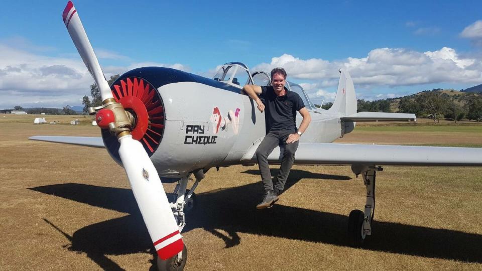 Pilot Marcel van Hattem pictured next to a small aircraft.