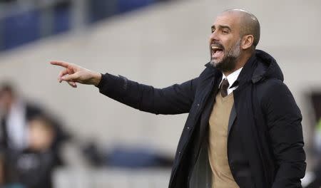 Football Soccer - Hanover 96 v Bayern Munich - German Bundesliga - HDI Arena, Hanover, Germany- 05/12/15 Bayern Munich's coach Pep Guardiola during the match. REUTERS/Fabian Bimmer