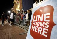 Shoppers line up outside a Best Buy department store waiting for it to be opened at midnight for Black Friday sales Thursday, Nov. 22, 2012, in Arlington, Texas. (AP Photo/Tony Gutierrez)