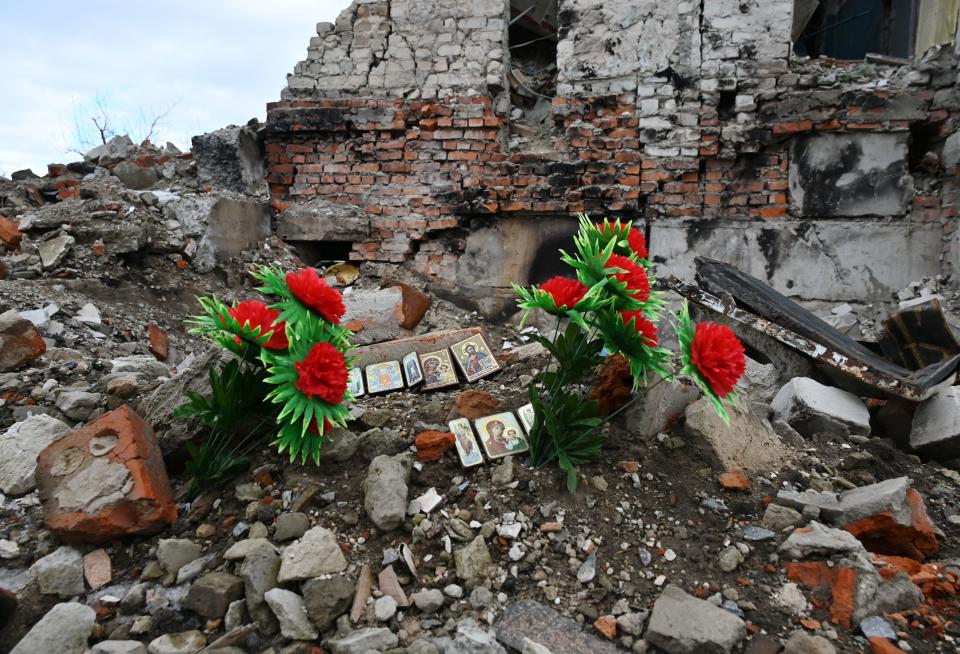A makeshift memorial for civilians killed in a destroyed residential building, in Izyum amid the Russian invasion of Ukraine, February 20, 2023.