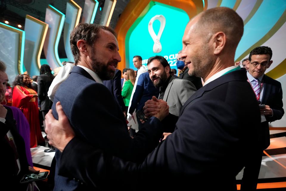 England's head coach Gareth Southgate, left, talks to United States' head coach Gregg Berhalter after the 2022 soccer World Cup draw at the Doha Exhibition and Convention Center in Doha, Qatar, Saturday, April 2, 2022. (AP Photo/Hassan Ammar)