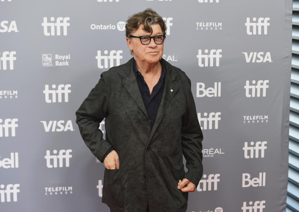 FILE - This Sept. 5, 2019 file photo shows Robbie Robertson at a press conference for "Once Were Brothers: Robbie Robertson and The Band" at the Toronto International Film Festival in Toronto. Robertson has a new album "Sinematic," has scored the upcoming Martin Scorcese film “The Irishman,” is writing a second volume of his memoir “Testimony” and is celebrating the 50th anniversary of The Band’s self-titled album with a new box set. (Photo by Chris Pizzello/Invision/AP, File)