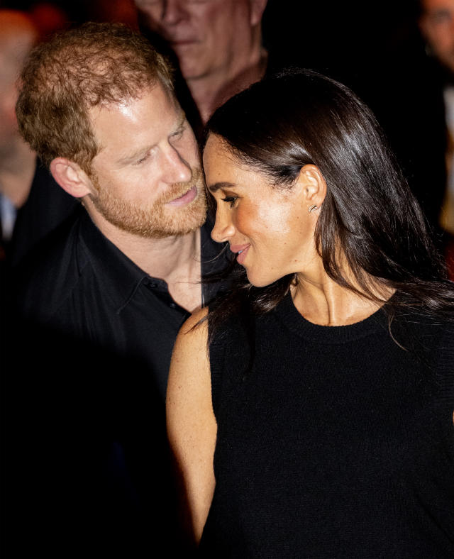 Meghan Markle opts for comfy-looking designer ensemble - including $770  Valentino flats and a $2,650 Goyard tote - as she jets to join Prince Harry  ahead of Invictus Games