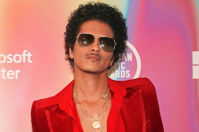<p>John Esparza via Getty Images</p> Bruno Mars poses for a photo at the 2021 American Music Awards