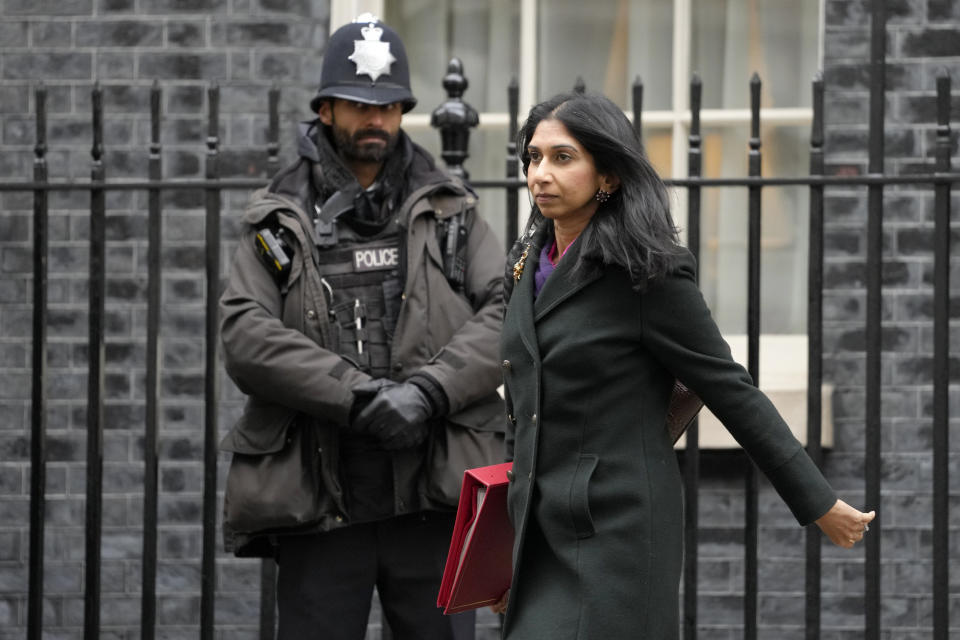 FILE - Britain's Home Secretary Suella Braverman leaves after attending a Cabinet meeting in Downing Street in London, on Dec. 13, 2022. Judges at Britain’s High Court are set to rule Monday on whether the U.K. government’s controversial plan to send asylum-seekers on a one-way trip to Rwanda is legal. Several asylum-seekers, aid groups and a border officials’ union are trying to stop the Conservative government acting on a deportation agreement with Rwanda that aims to deter migrants from crossing the English Channel in small boats. (AP Photo/Kirsty Wigglesworth, File)