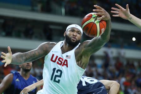 Aug 14, 2016; Rio de Janeiro, Brazil; United States center Demarcus Cousins (12) reaches for the ball against France during the men's preliminary round in the Rio 2016 Summer Olympic Games at Carioca Arena 1. Jeff Swinger-USA TODAY Sports