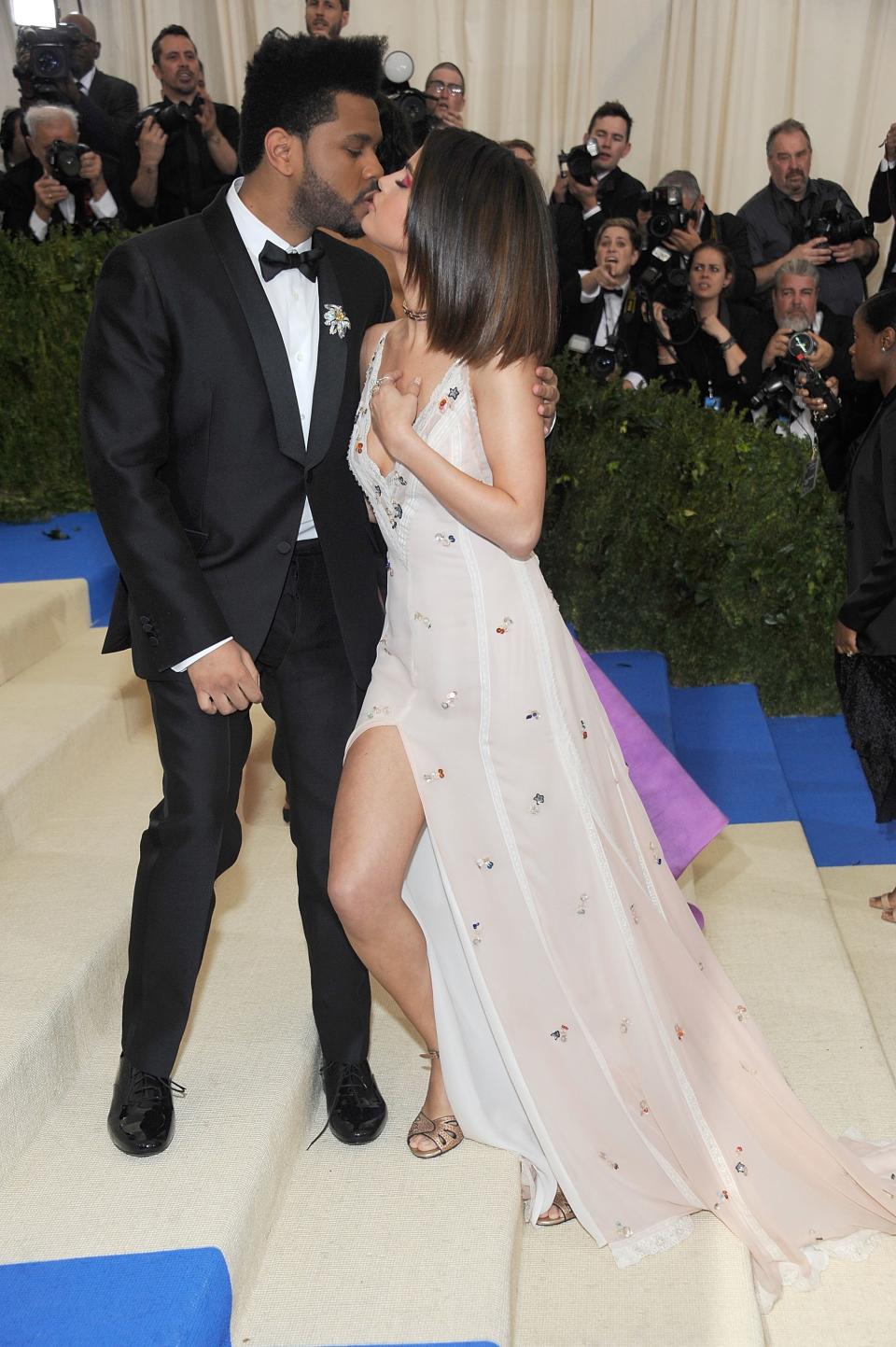 Selena Gomez and The Weekend made their relationship official at the 2017 Met Gala, posing for several adorable couple photos.