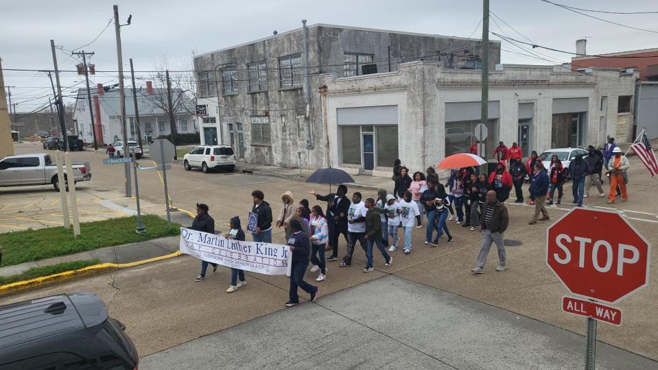 Attendees of the Terrebonne Parish Dr. Martin Luther King Jr. Day celebration march from the Houma Courthouse Square to the Dumas Auditorium, Monday, January 15.