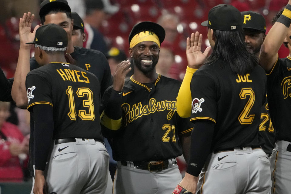 Pittsburgh Pirates' Andrew McCutchen celebrates a 4-2 victory over the St. Louis Cardinals with teammates Ke'Bryan Hayes (13) and Connor Joe (2) following a baseball game Friday, Sept. 1, 2023, in St. Louis. (AP Photo/Jeff Roberson)