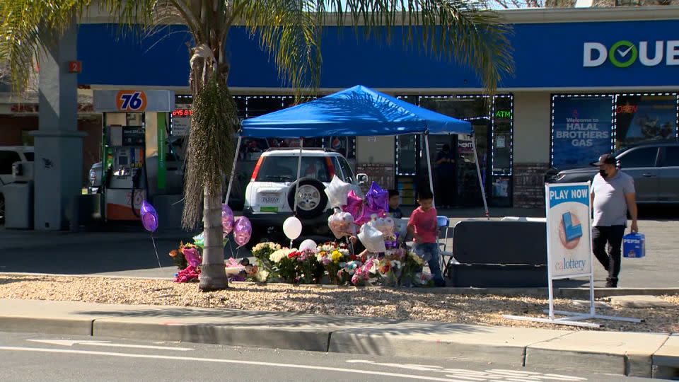 A makeshift memorial is seen at a gas station where a 2-year-old was killed in Woodland, California. - KCRA