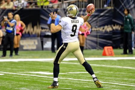 Oct 4, 2015; New Orleans, LA, USA; New Orleans Saints quarterback Drew Brees (9) throws the ball for a 80 yard game winning touchdown pass to running back C.J. Spiller (not pictured) during overtime against the Dallas Cowboys at the Mercedes-Benz Superdome. Derick E. Hingle-USA TODAY Sports